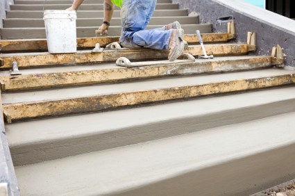 Clover Home Improvements LLC mason building cement steps in Sagamore Beach, MA.